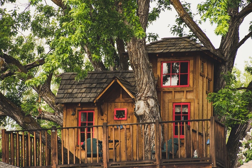 wooden playhouse with veranda